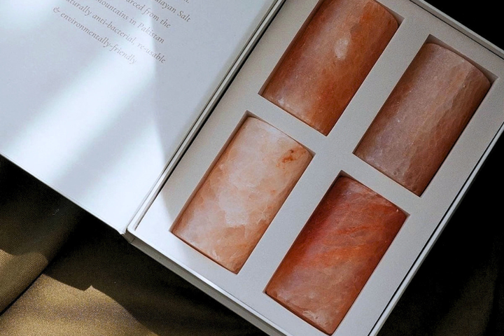 Himalayan salt stones in an unbranded box with the origin printed inside the lid, an example of a named-source LP annual meeting gift that fits in a carry-on