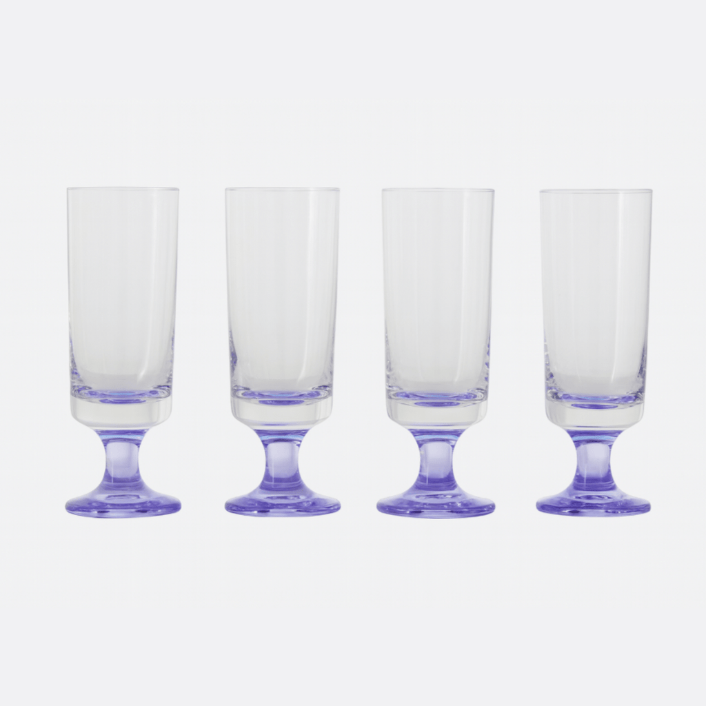 Set of four vintage champagne flutes with purple crystal stems – 1970s collectible barware, clear glass with amethyst foot, perfect for retro entertaining.